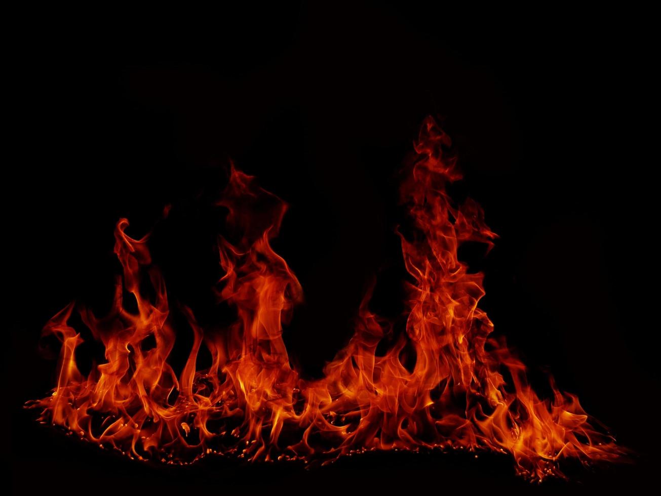 Flame Flame Texture For Strange Shape Fire Background Flame meat that is burned from the stove or from cooking. danger feeling abstract black background Suitable for banners or advertisements. photo