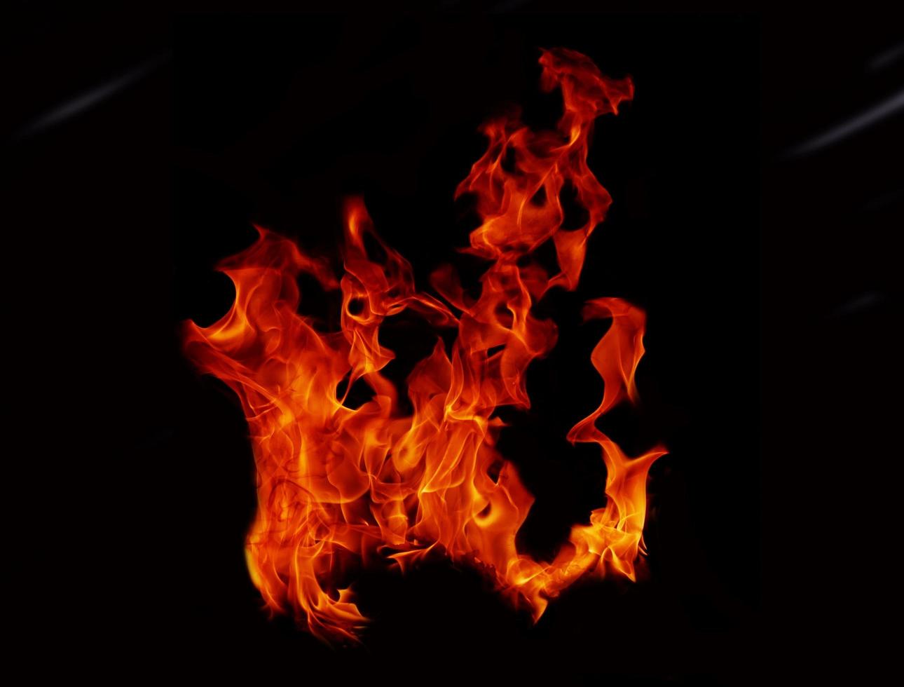 Flame Flame Texture For Strange Shape Fire Background Flame meat that is burned from the stove or from cooking. danger feeling abstract black background Suitable for banners or advertisements. photo