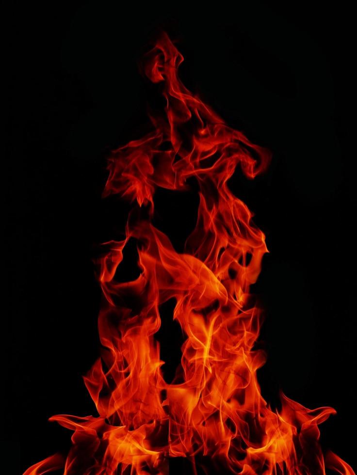 Flame Flame Texture For Strange Shape Fire Background Flame meat that is burned from the stove or from cooking. danger feeling abstract black background Suitable for banners or advertisements. photo