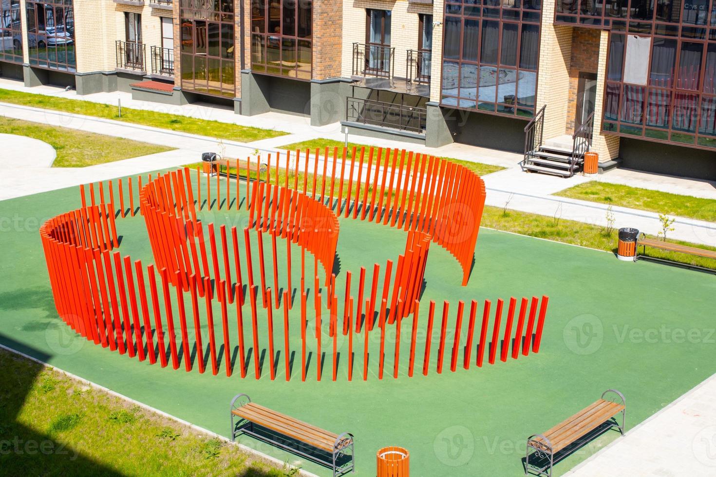 Red design for games on the playground. Wooden building. photo
