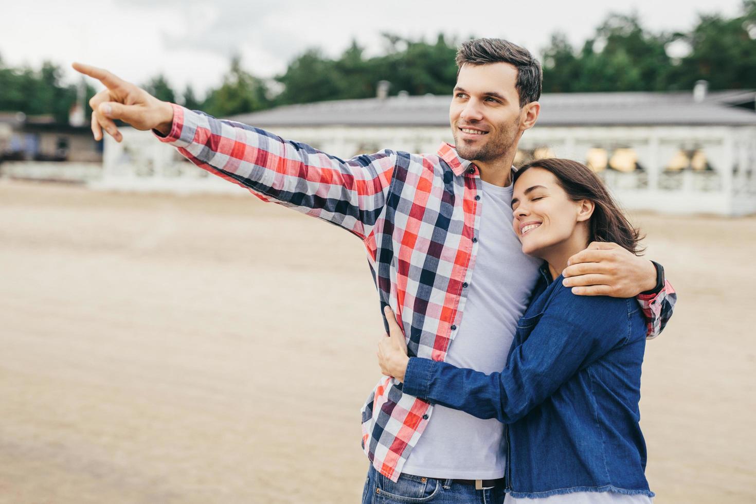 Woman and man embrace. photo