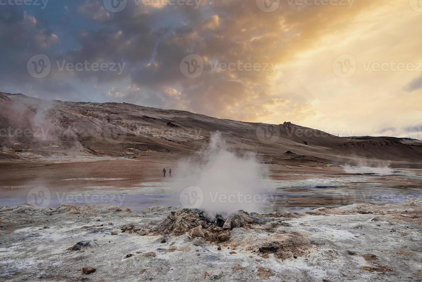 Scenic view of steaming fumarole in geothermal area of Hverir at Namafjall photo