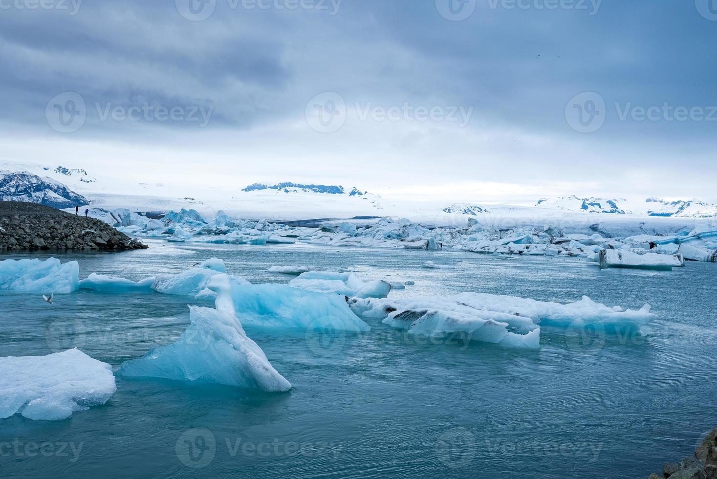 Beautiful icebergs floating in Jokulsarlon glacier lagoon in polar climate photo