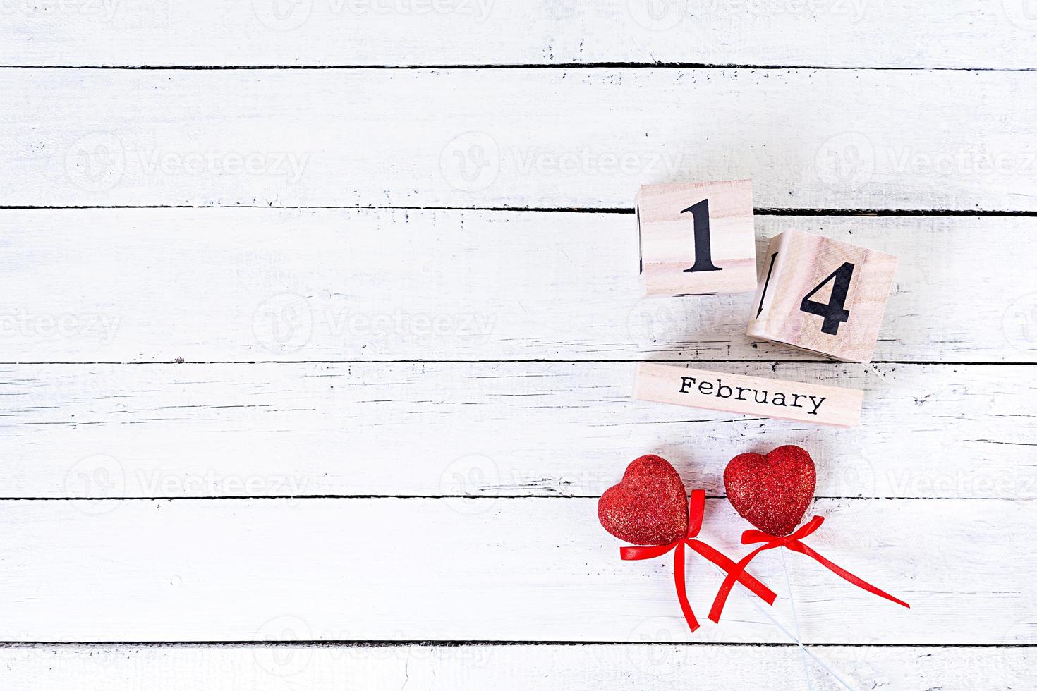 Valentine day. Wooden calendar with February 14 on it. photo