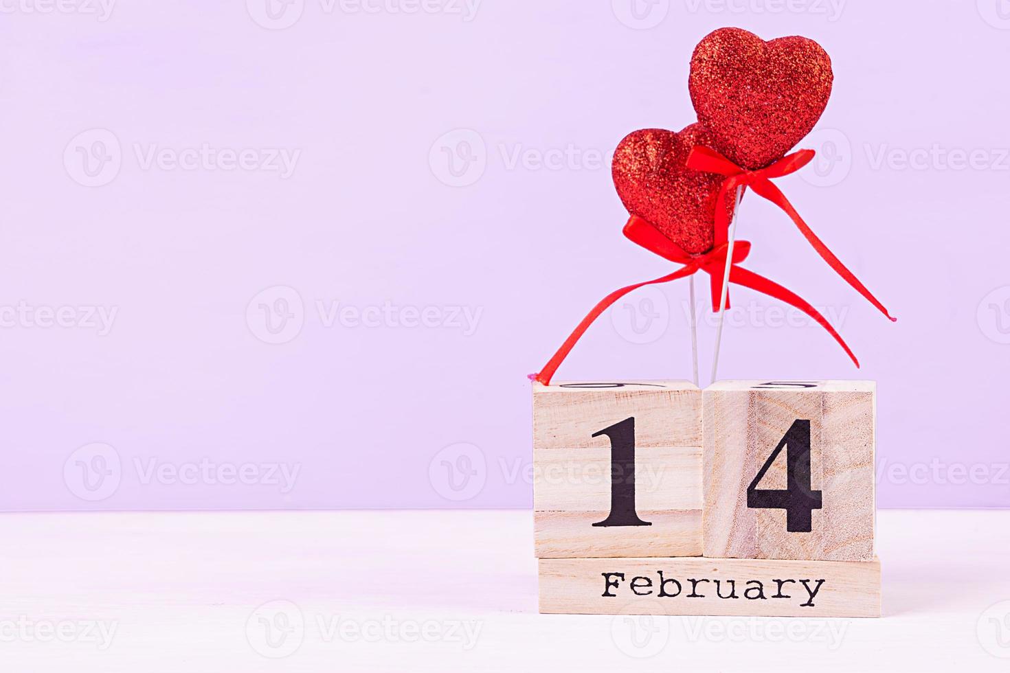 Valentine day. Wooden calendar with February 14 on it. photo