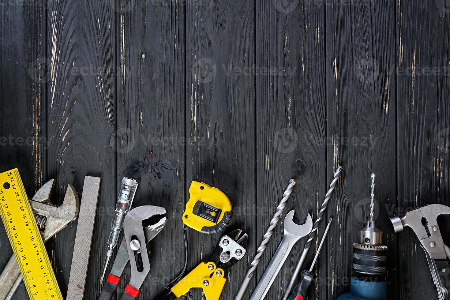 Set of working tools on wooden rustic background. Top view. Copy space photo