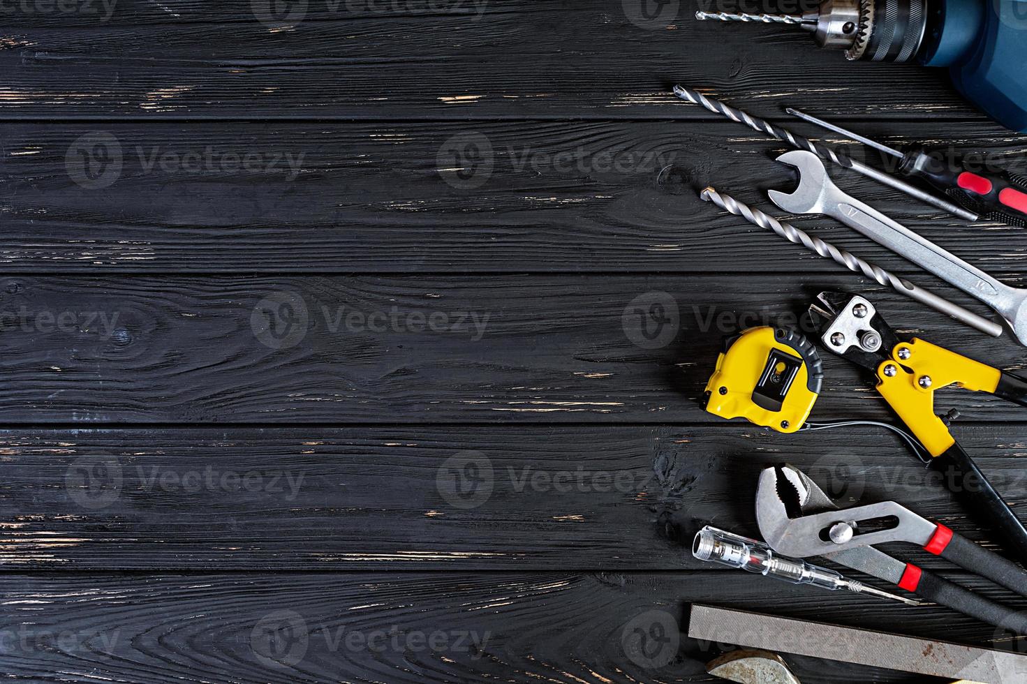 Set of working tools on wooden rustic background. Top view. Copy space photo