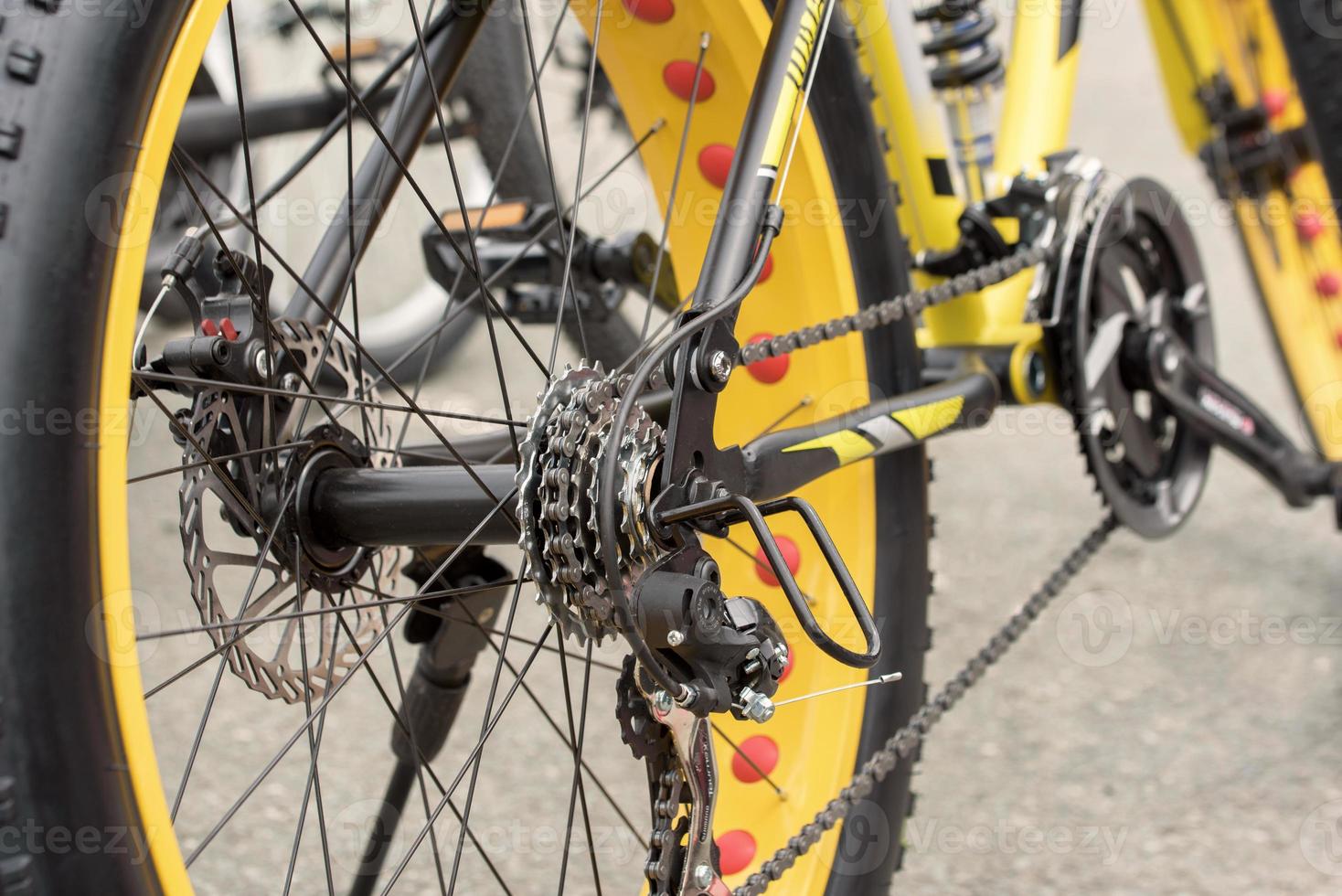 Yellow bicycle close-up photo