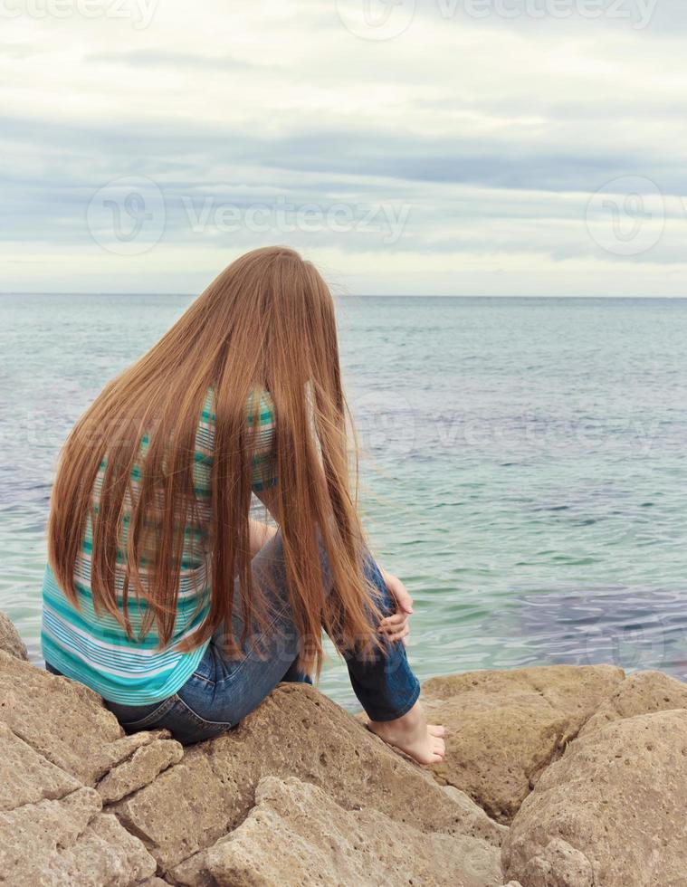 sad girl sitting photo