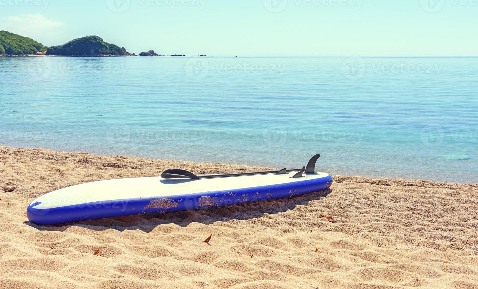 SUP board on the sand photo