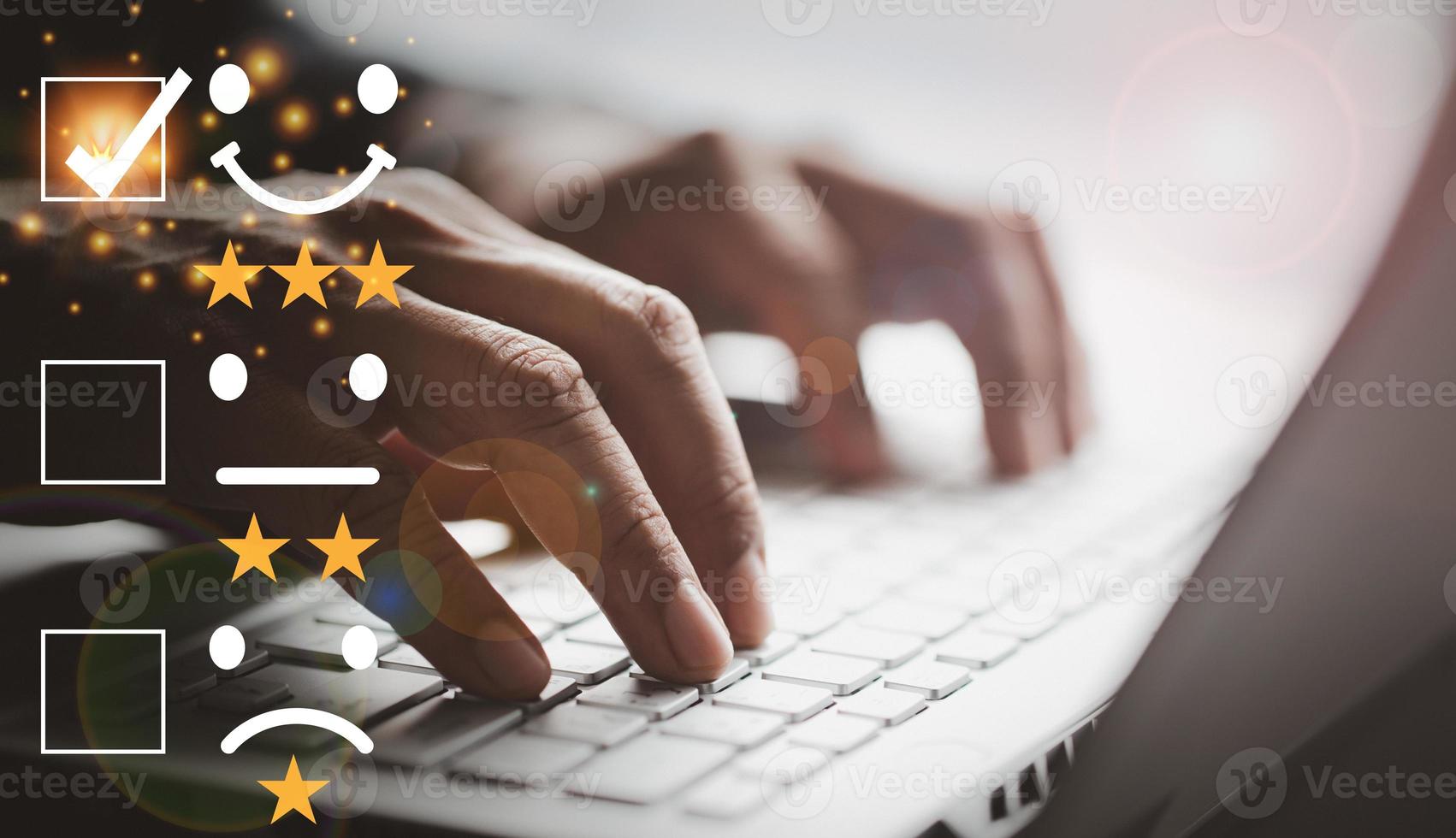 Satisfaction customer service survey concept, business man's hand is analyzing the questionnaire and combining the satisfaction score, giving satisfaction rating with smiley icon and five yellow stars photo