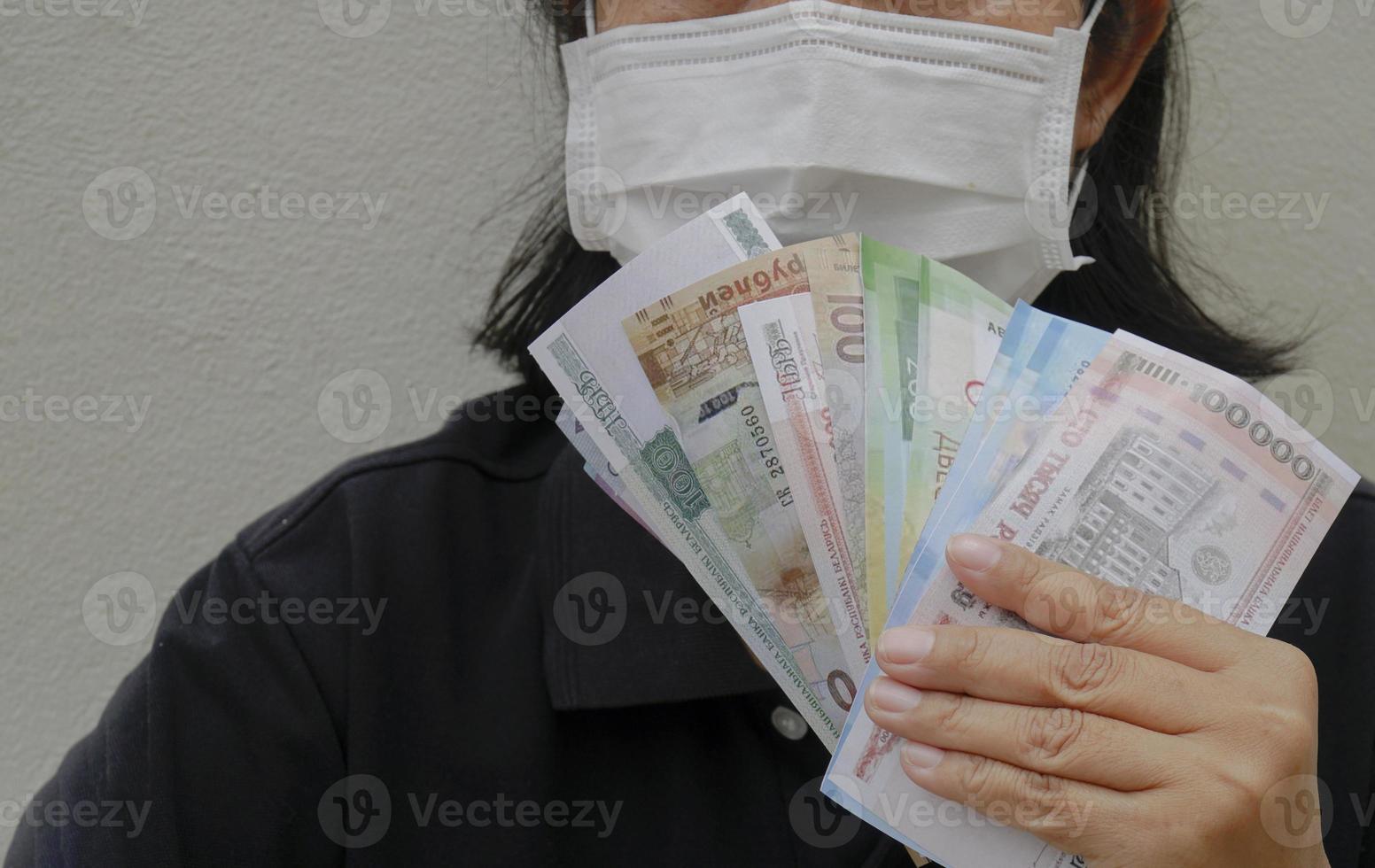 asian women Count Russian rubles in your hand. photo