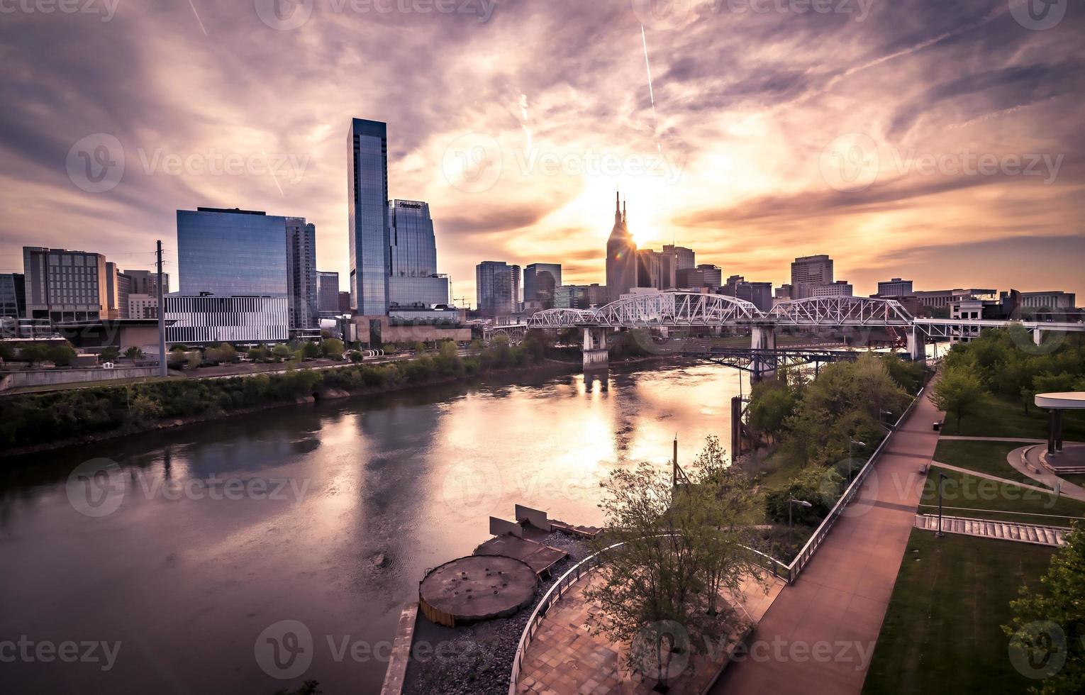 Nashville tennessee city skyline at sunset on the waterfrom photo