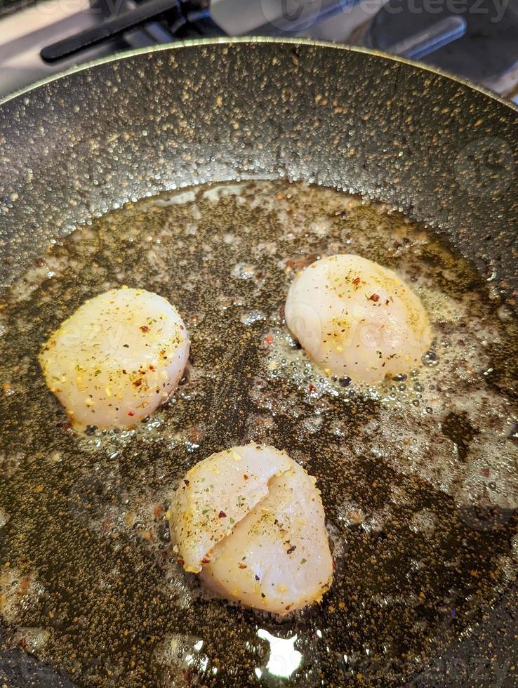 Fried scallops with butter and garlic sauce photo