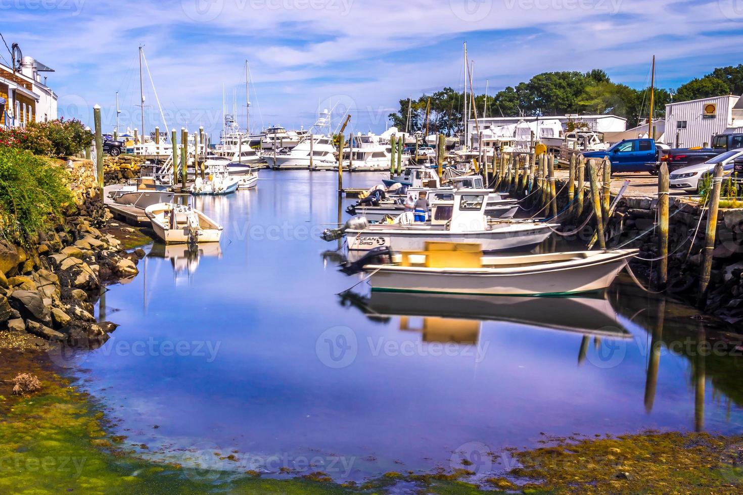 Small boats lining waterfront in Wickford Cove photo