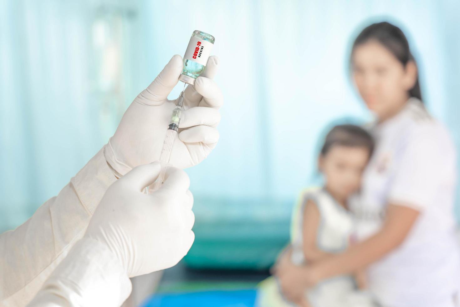 close up doctor holding syringe to injection to the patient in medical. Covid-19 or coronavirus vaccine. virus removal and prevention concept photo
