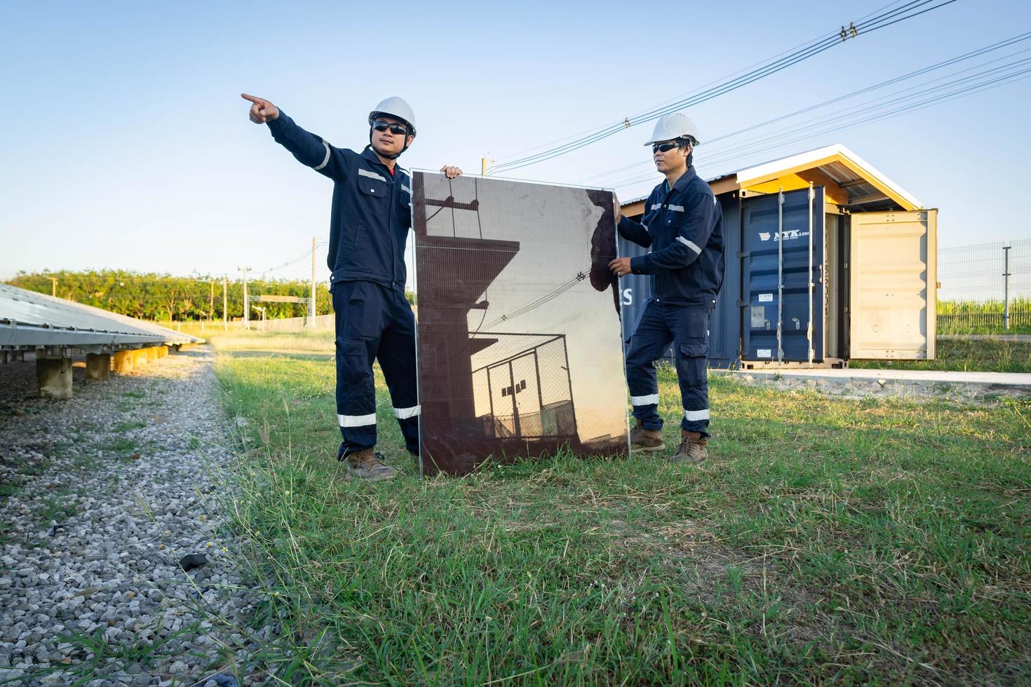 Technician is lifting the solar cell to replace the damaged one, Alternative energy to conserve the world's energy, Photovoltaic module idea for clean energy production photo