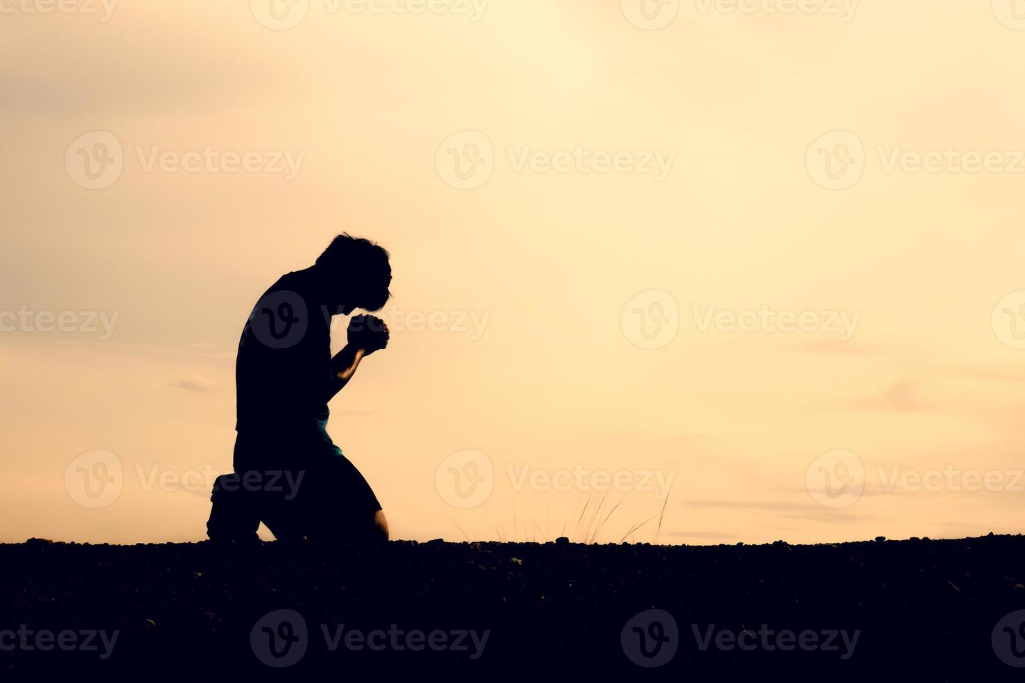 The silhouettes of men are sitting in despair. The concept was discouraged and hopeless. photo