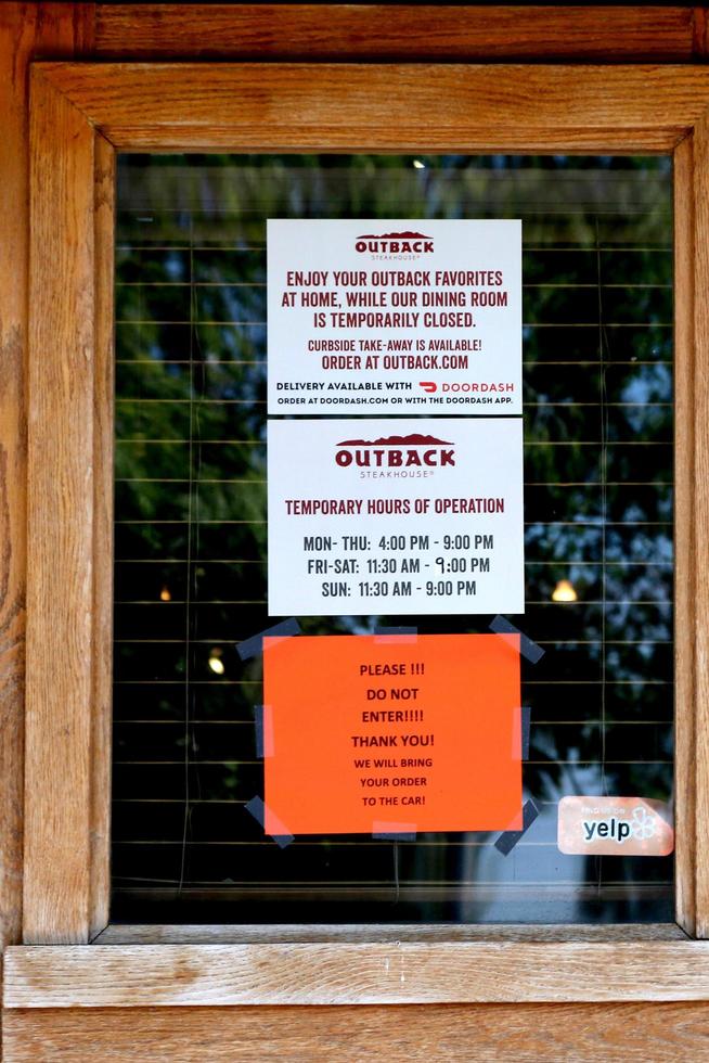 LOS ANGELES  APR 11 - Outback Steakhouse Resturant and Signage at the Businesses reacting to COVID 19 at the Hospitality Lane on April 11, 2020 in San Bernardino, CA photo