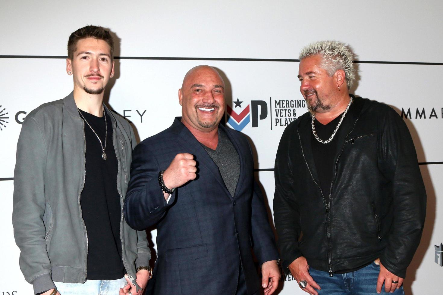 LOS ANGELES - FEB 9  Hunter Fieri, Jay Glazer, Guy Fieri at the Merging Vets and Players Charity Super Bowl Kick Off Benefit at Academy LA Nightclub on February 9, 2022 in Los Angeles, CA photo