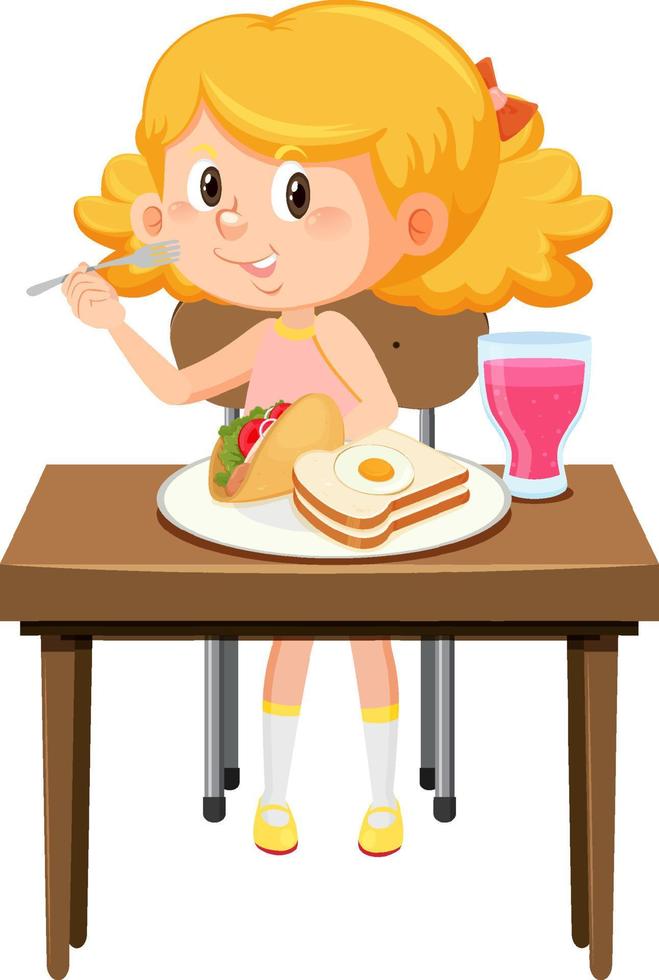 niña feliz disfruta comiendo comida en la mesa vector