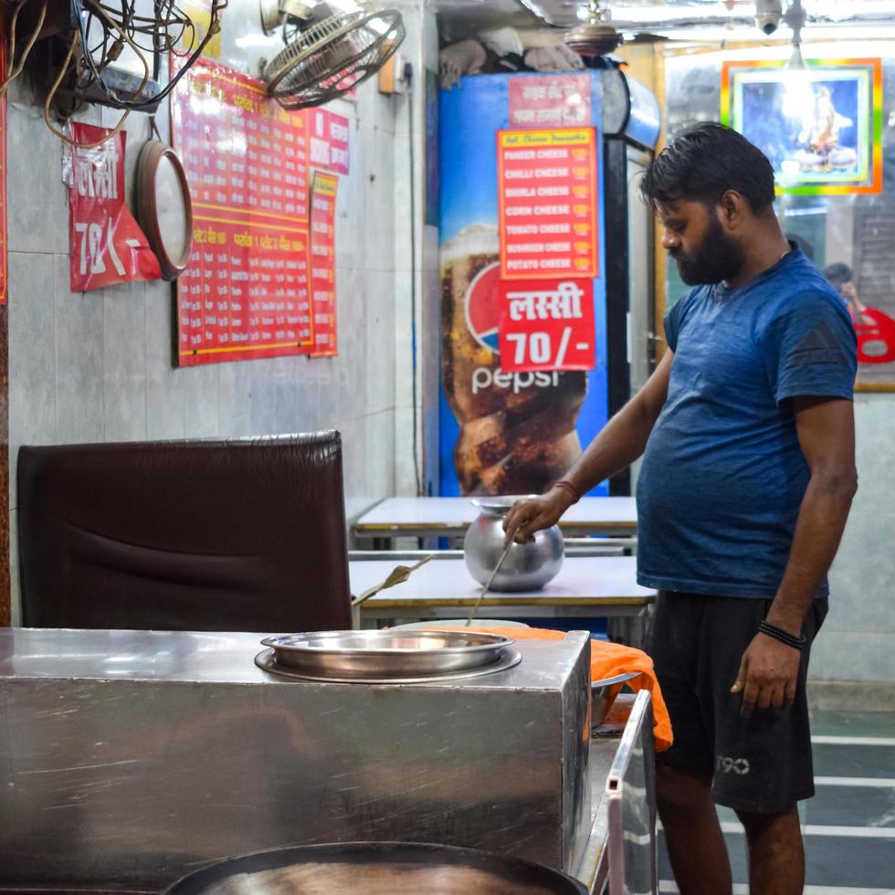 Old Delhi, India - April 15, 2022 - Portrait of shopkeepers or street vendors in Chandni Chowk market of Delhi, Old Delhi Street Photography photo