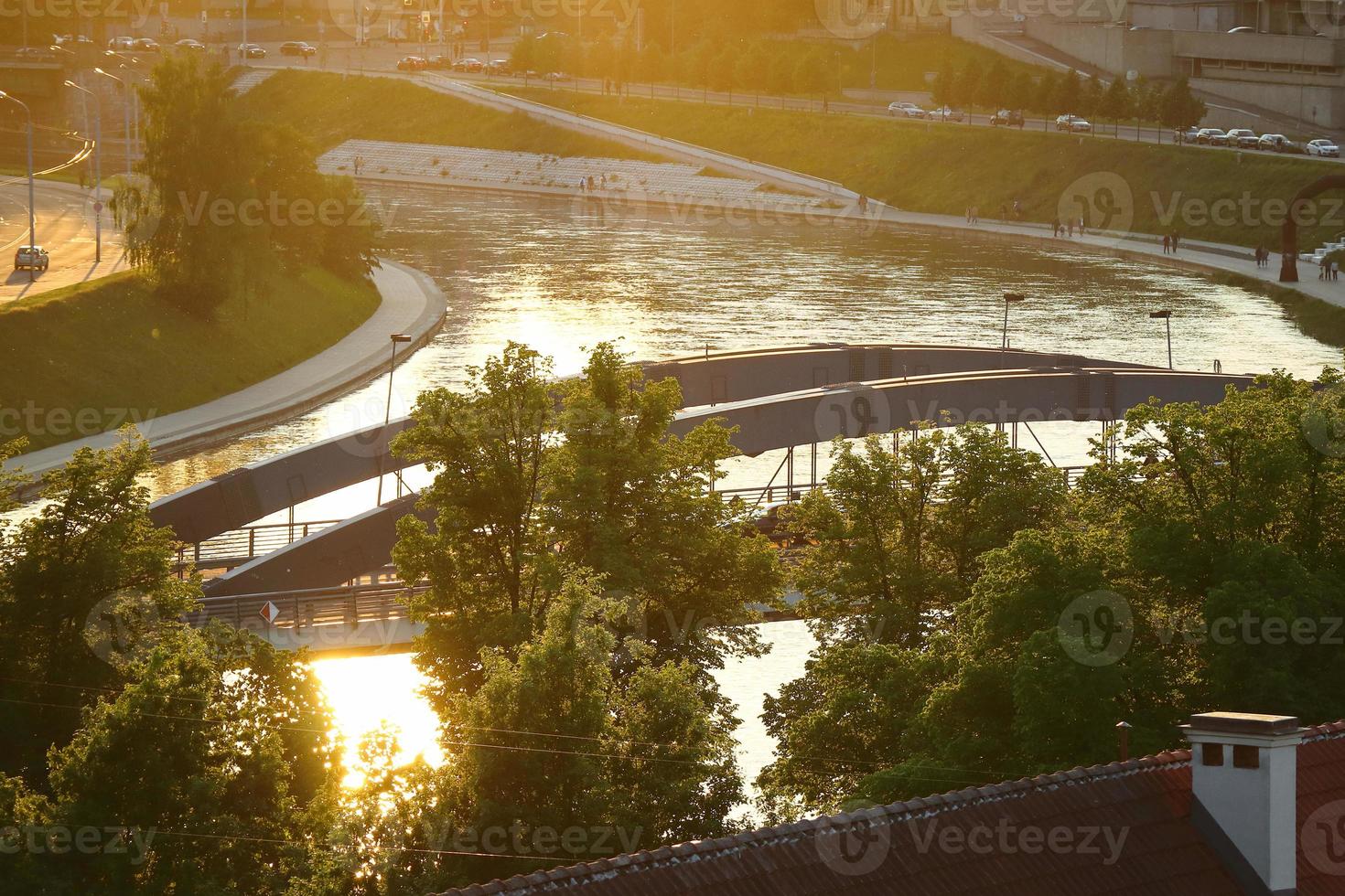 Cityscape view from Gediminas castle on the financial district with modern buildings, river and bridge during the sunset in Vilnius, Lithuania. photo