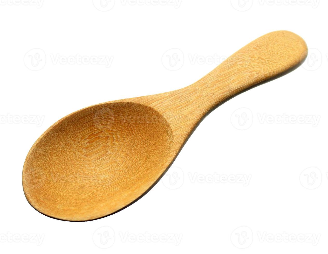 Wooden spoon isolated on white background photo