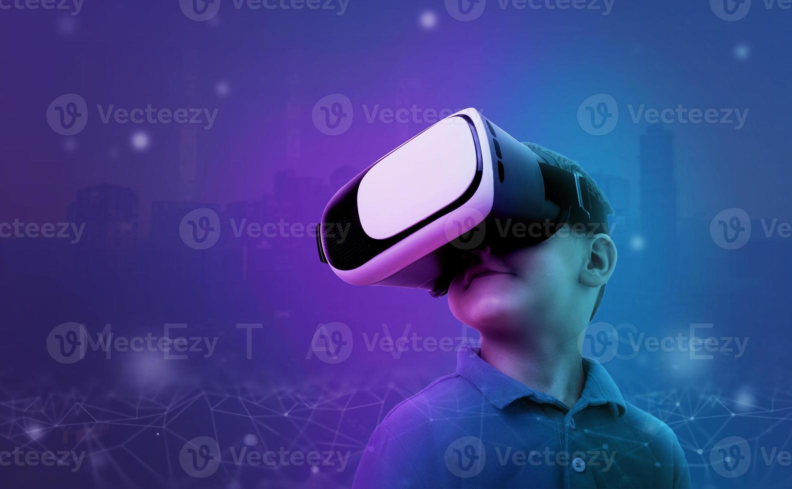 Boy with VR glasses in a metaverse environment concept. Purple background with net threads and outlines of the futuristic city of the future. photo