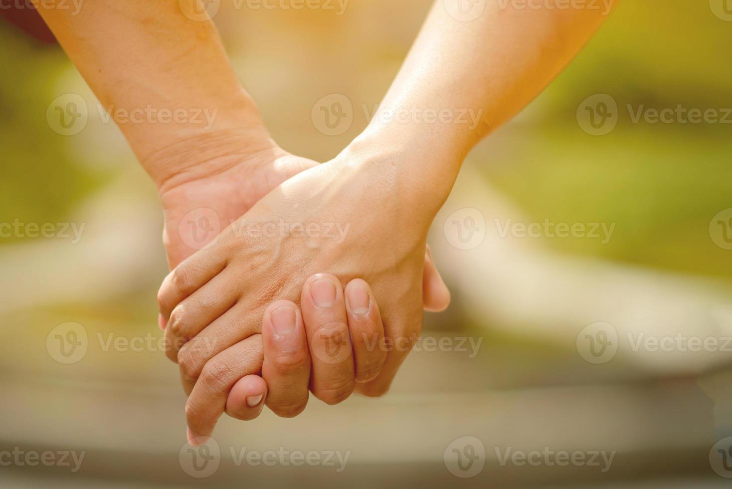 Men and women shake hands with love on valentines day photo