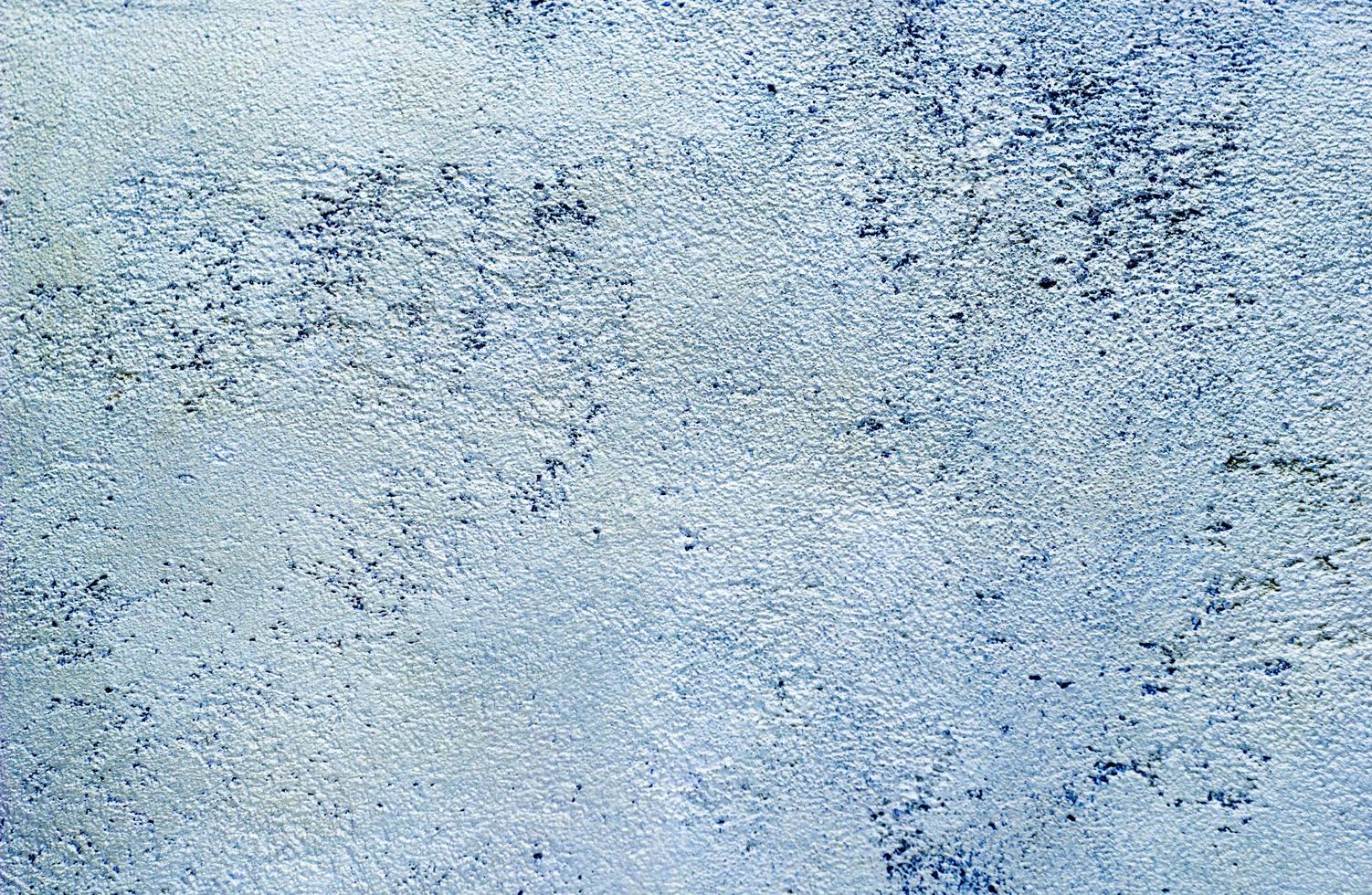 Abstract texture of decorative plaster. Grunge background of stucco texture. Blue grained surface photo