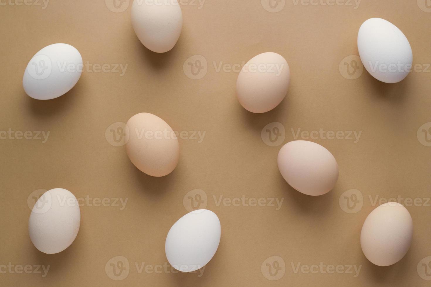 Easter eggs on pastel brown background for holiday. Top view. Flat lay. Minimal concept photo