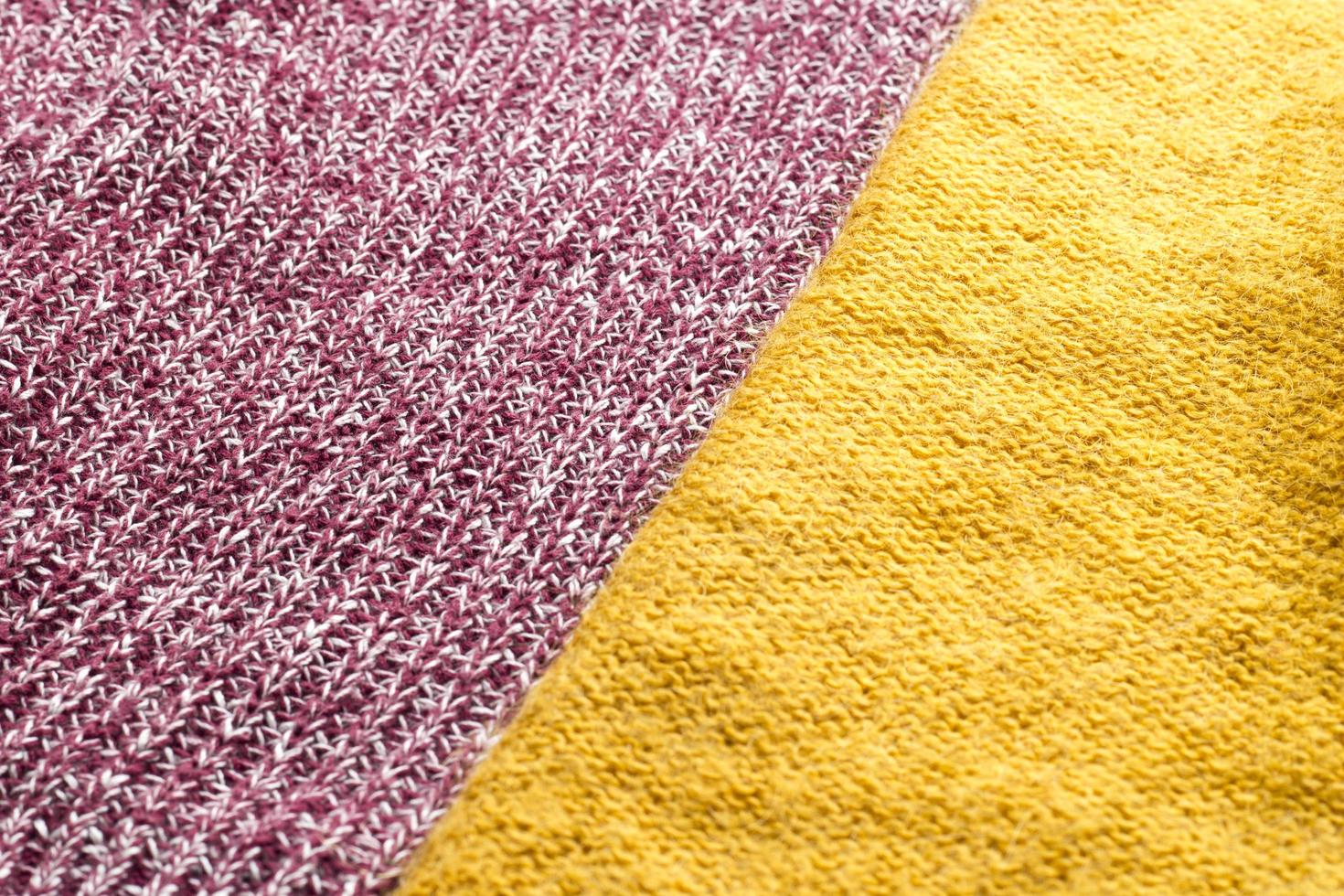 Close-up red and yellow knitted textiles for background. Top view textures of different fabrics. Minimalistic concept photo