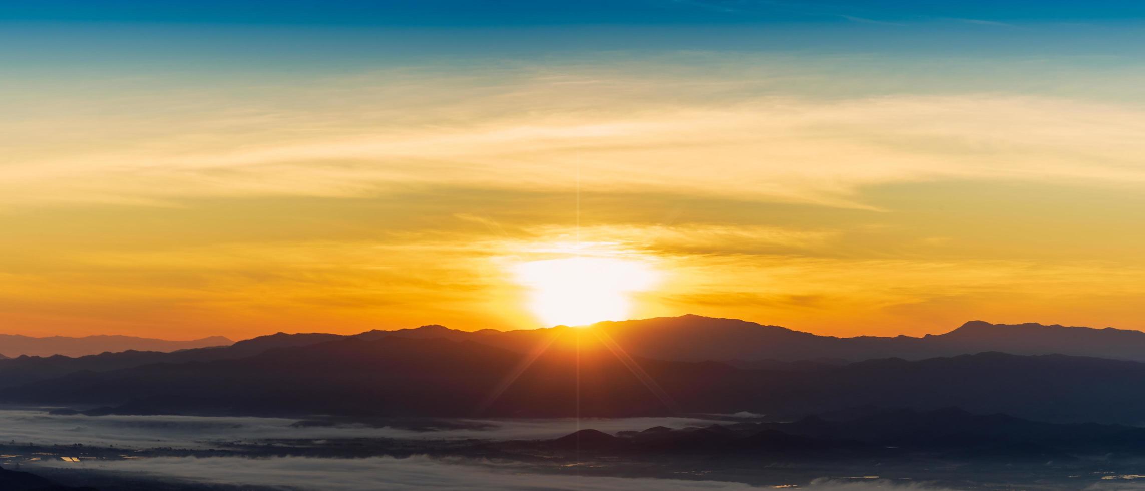 Beautiful foggy winter sunrise in mountains of north Thailand. photo