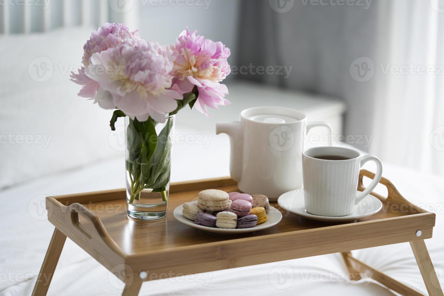 Tray with breakfast on bed. photo