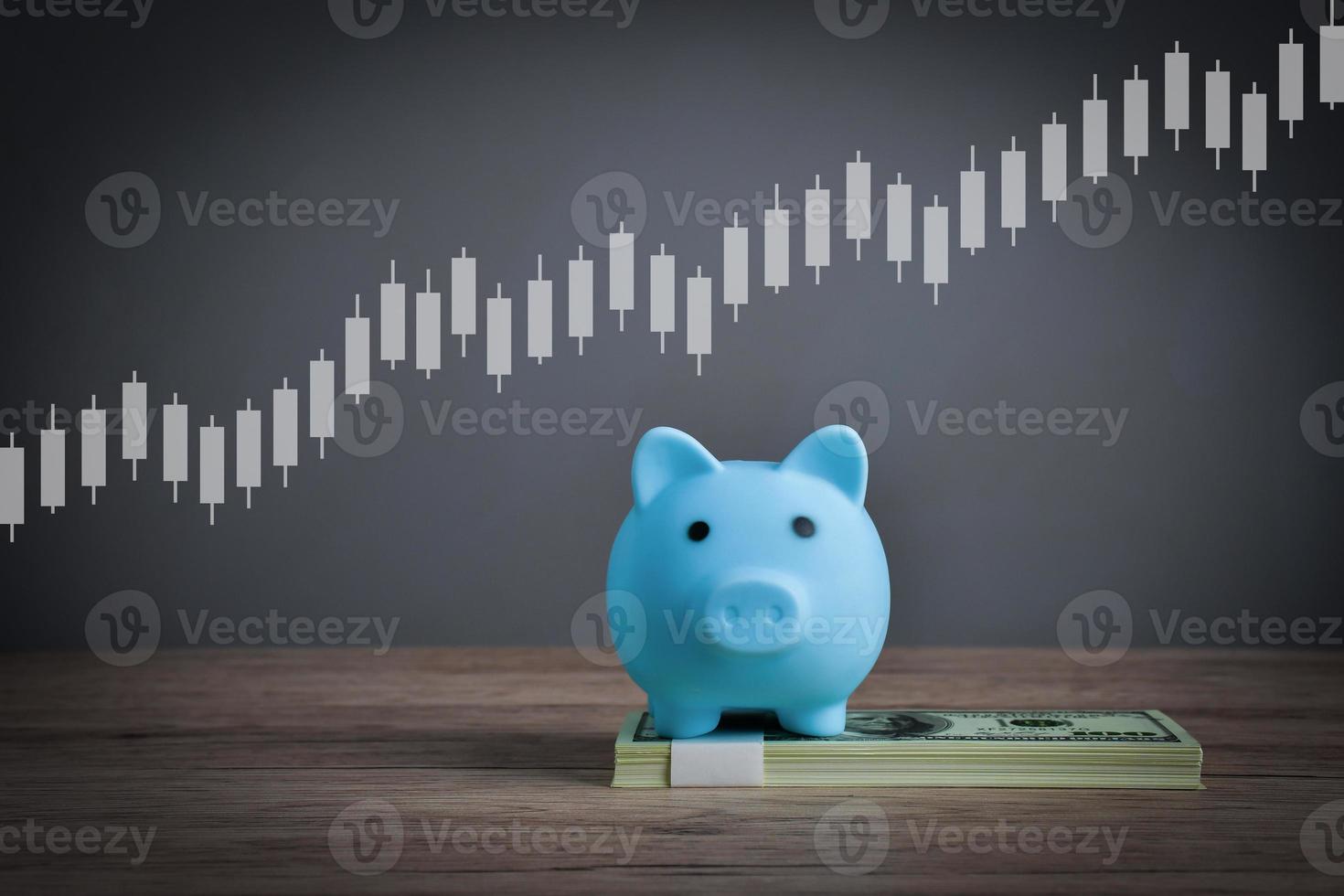 Saving a blue pig on a dollar bill to show wealth through saving money. photo