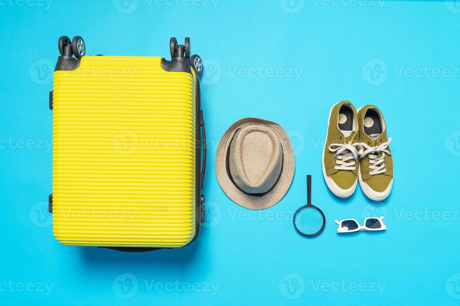 Man accessories lying flat on textured fabric background top view travel concept photo