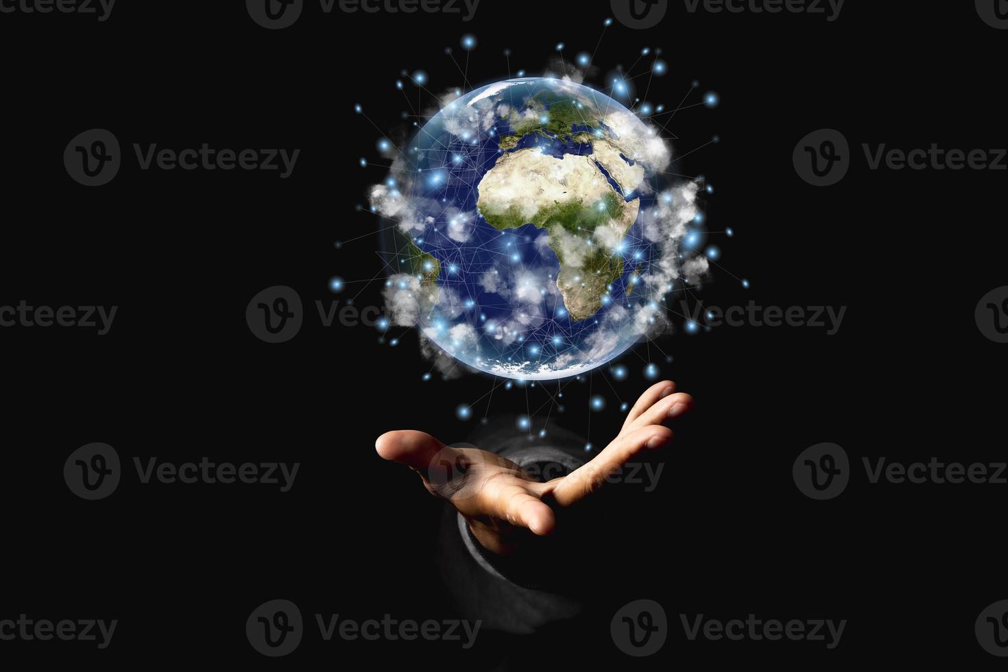 Environment concept. Earth in human hands on black background. Elements of this image furnished by NASA photo