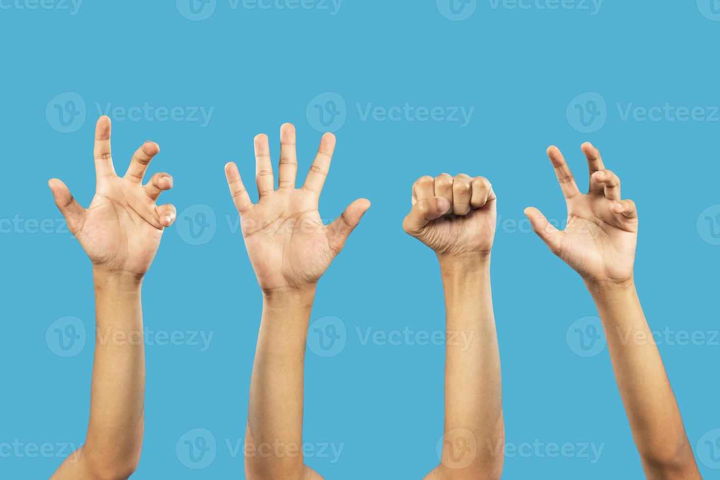Group of hand gestures isolated over the blue background. photo