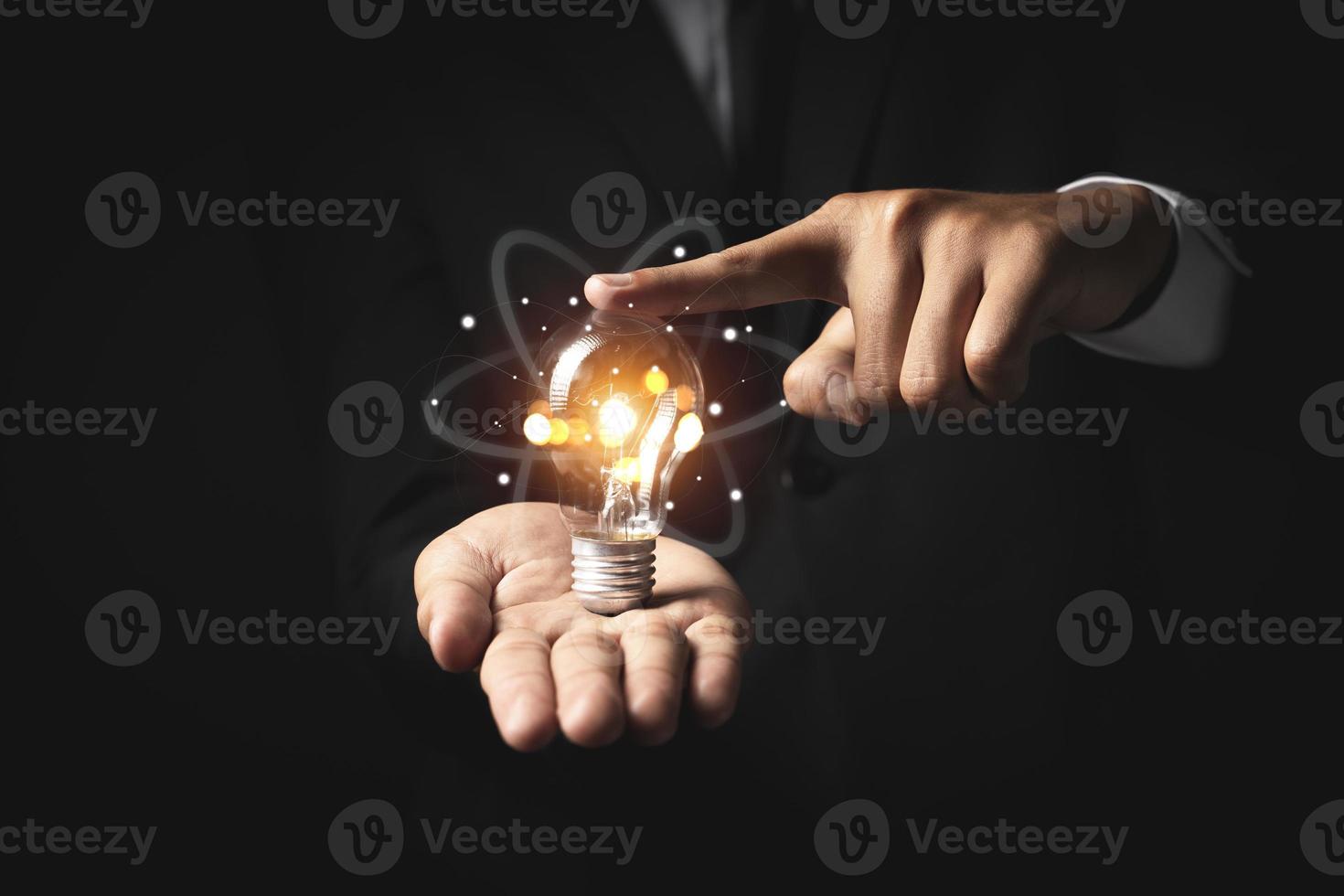 Hand of holding illuminated light bulb. idea innovation inspiration concept photo