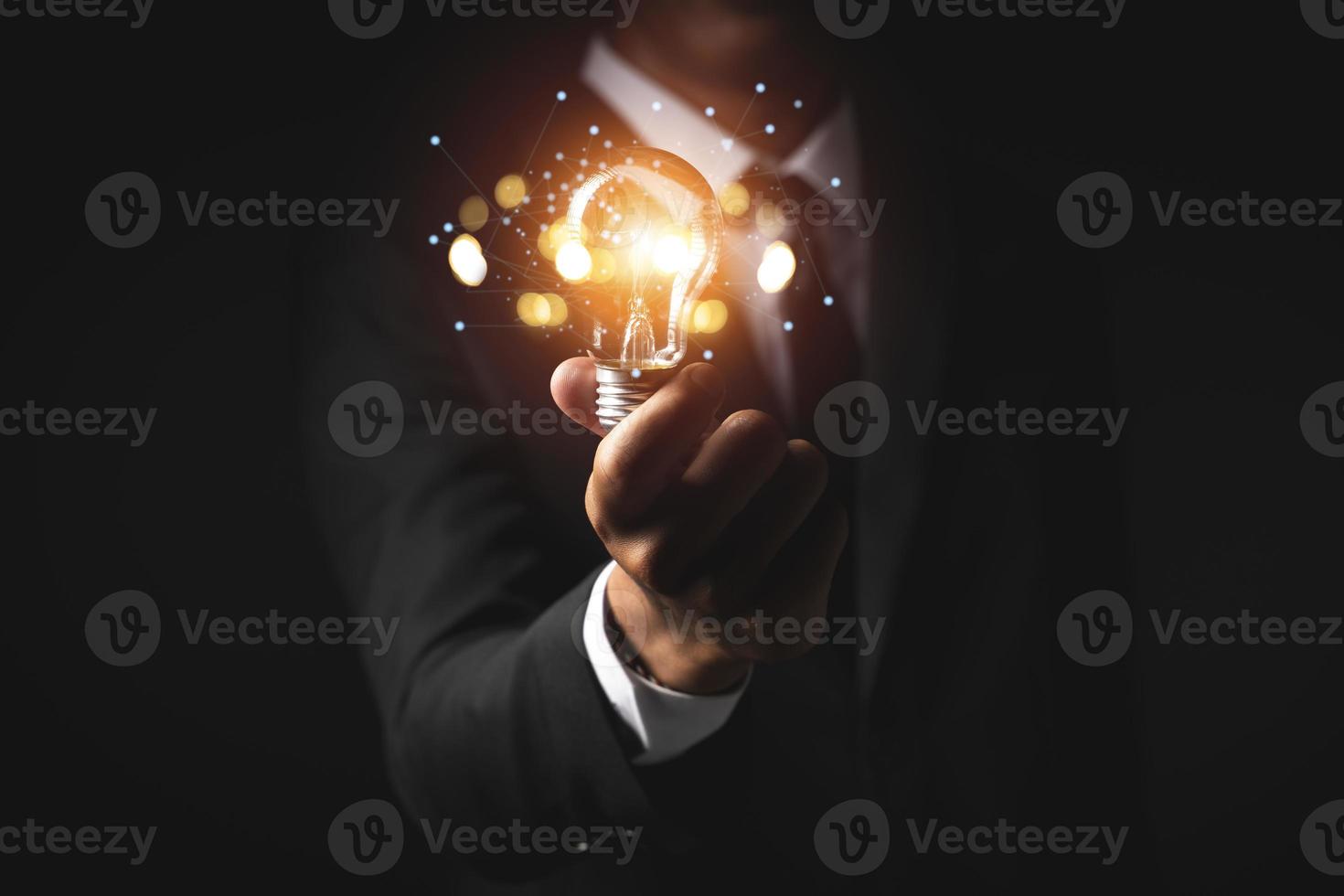 Hand of holding illuminated light bulb. idea innovation inspiration concept photo