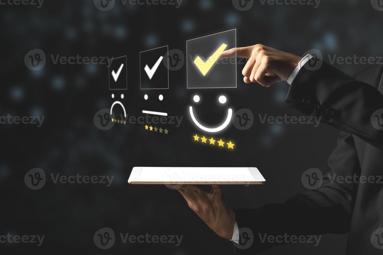 Businessman pressing excellent smiley face rating icon, customer service evaluation and feedback rating concept. photo