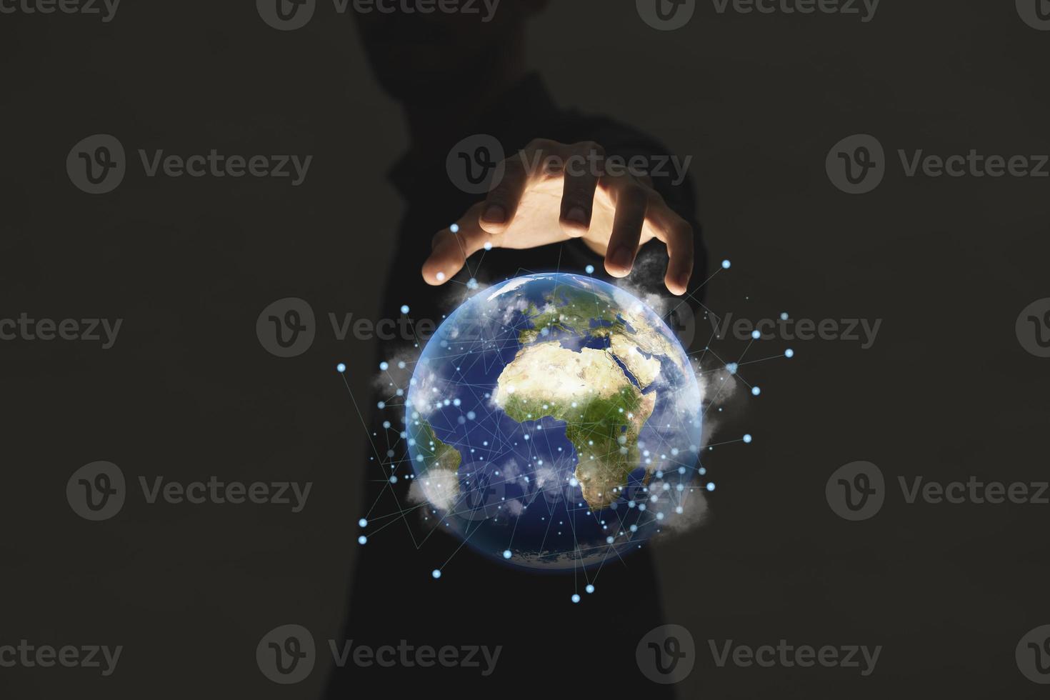 Hand holding earth on dark light background , Elements of image are furnished by NASA photo