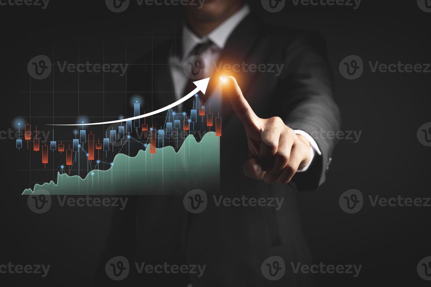 Businessman or trader is showing a growing virtual hologram stock, invest in trading photo