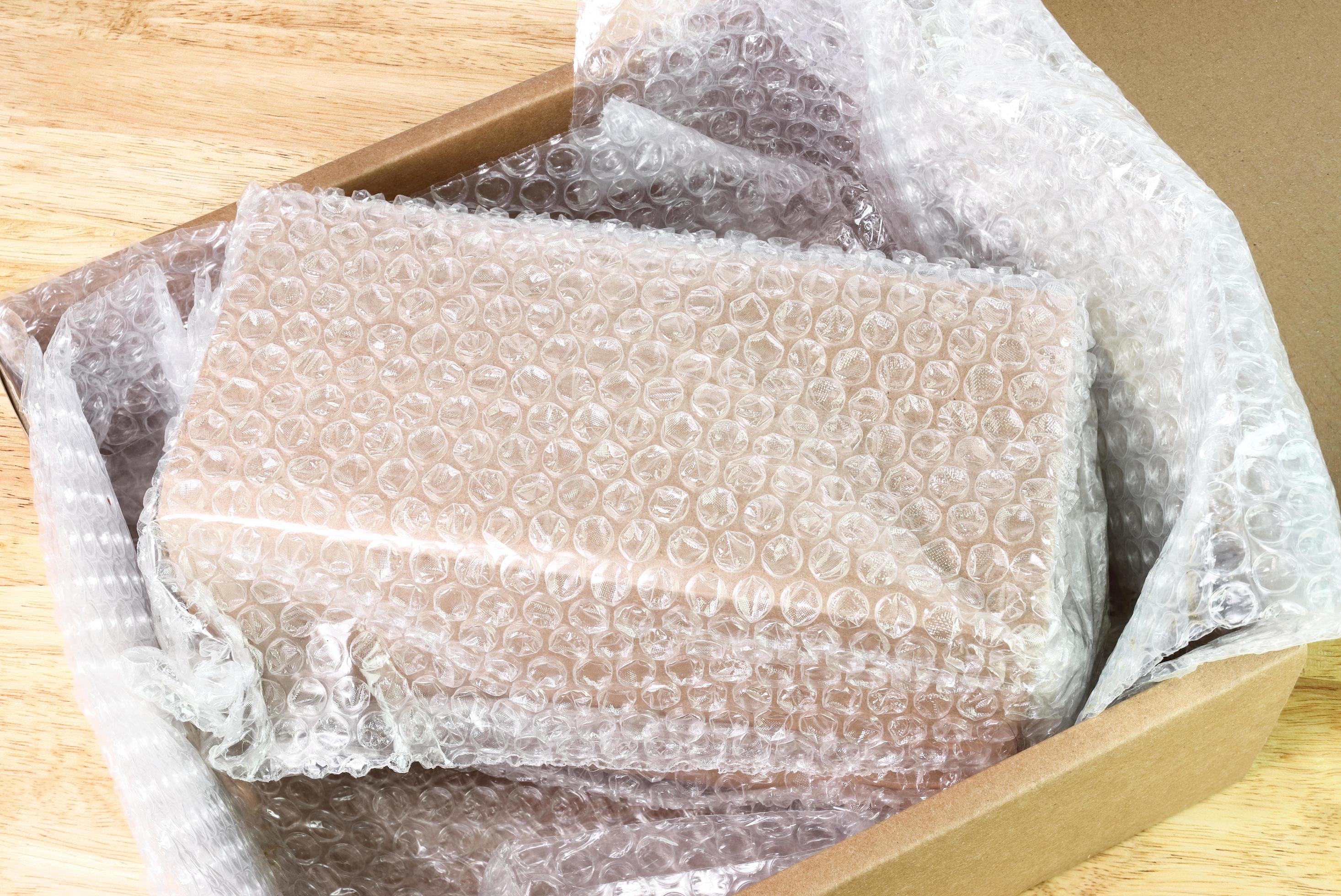 Bubbles covering the box by bubble wrap for protection product