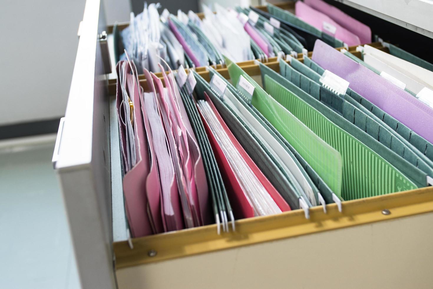 Files document of hanging file folders in a drawer in a whole pile photo