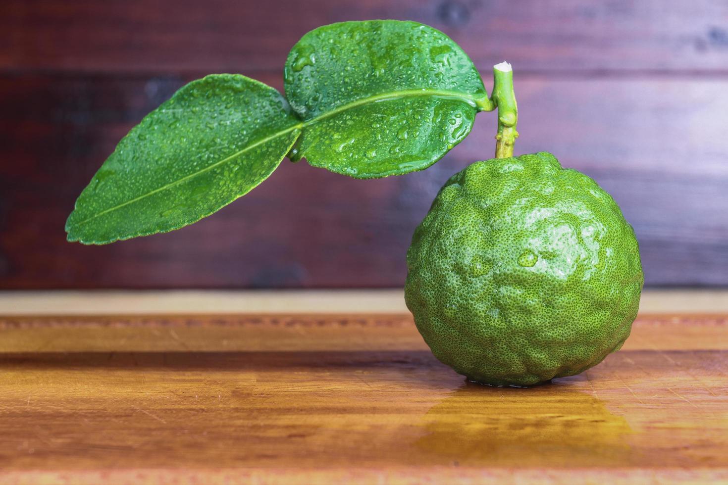fresh fruits bergamot on wood table. photo