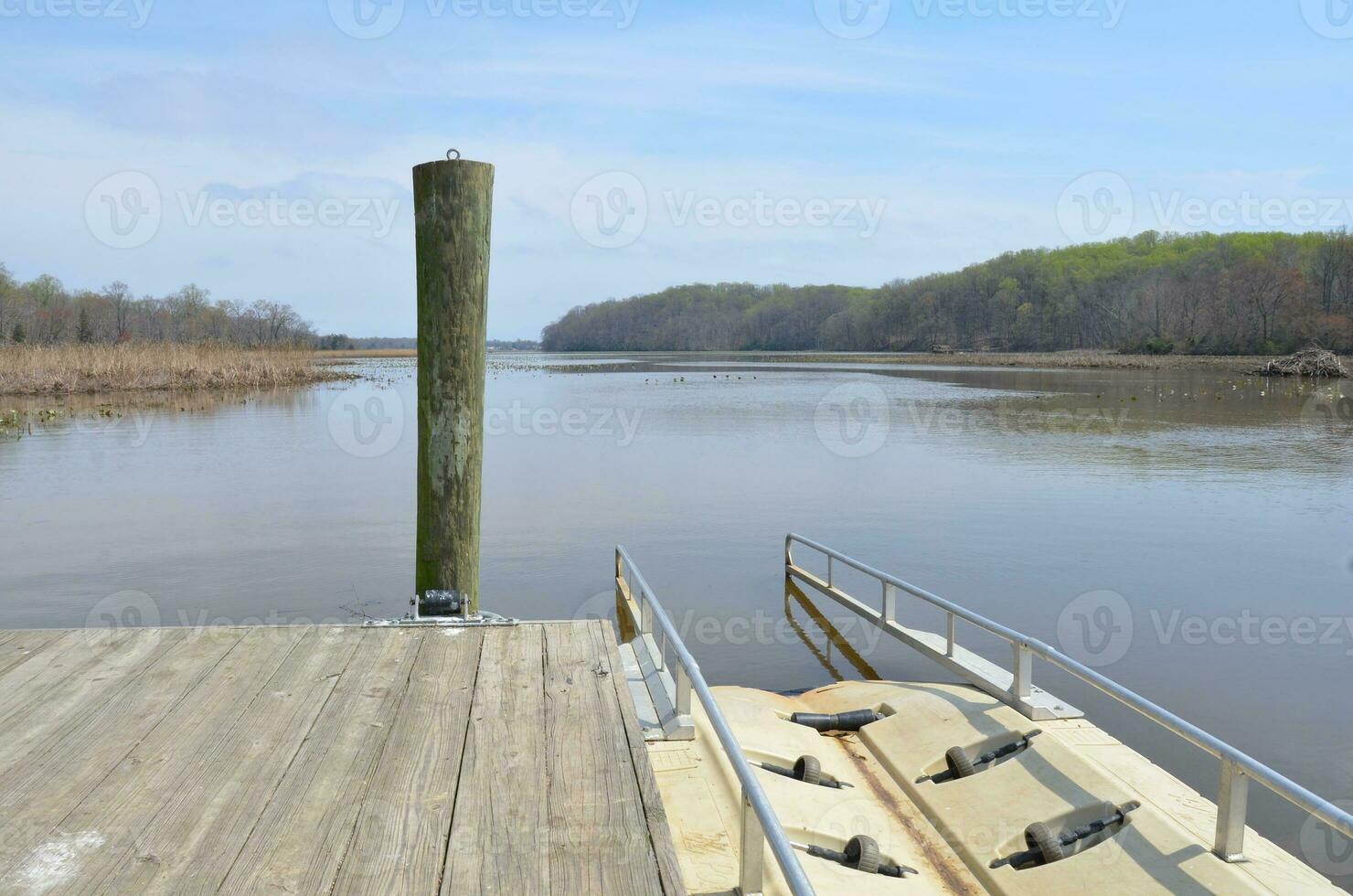 kayak launch ramp with river or lake water photo