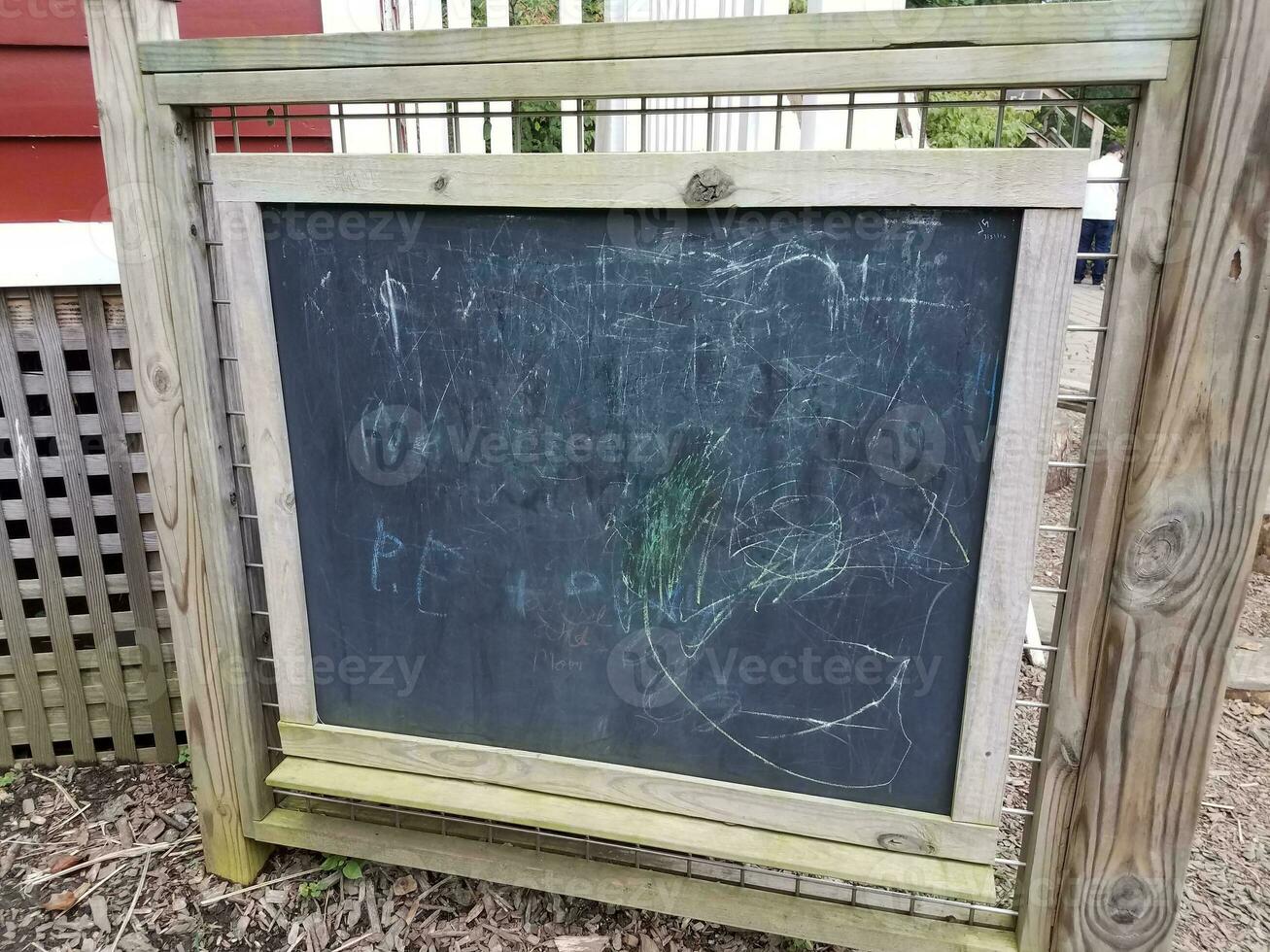 blackboard or chalkboard with scribbles on it photo