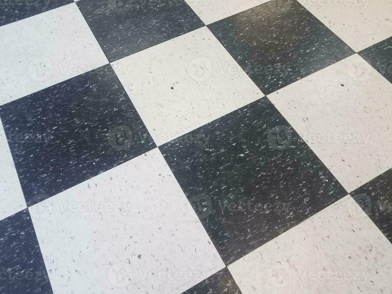 black and white square tile pattern on floor photo